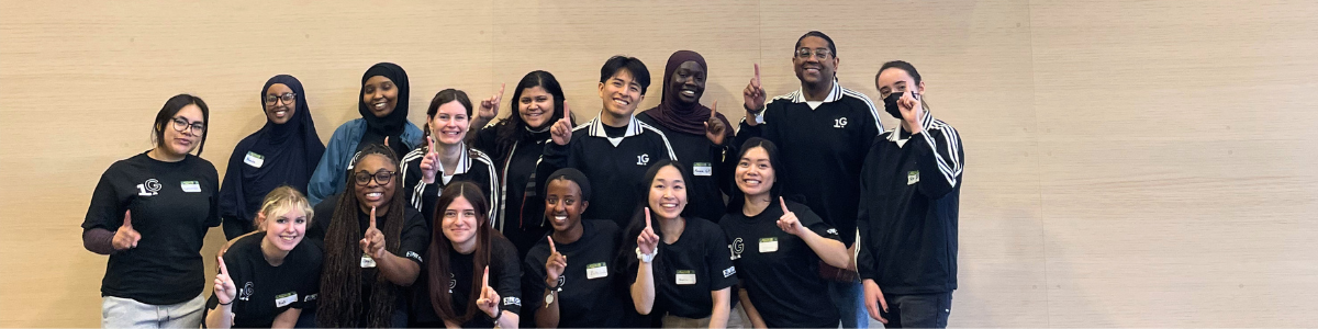 Students and staff pose at the First-Gen Day of Service, hosted at Second Harvest Heartland.