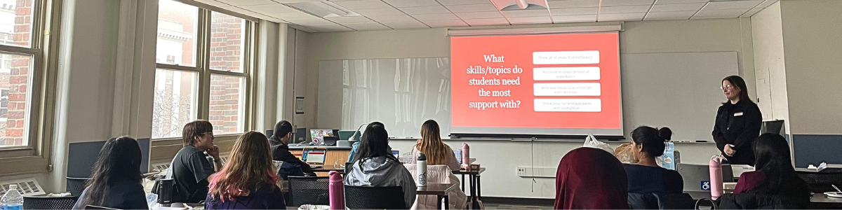 Students watch a presentation on academic study skills.