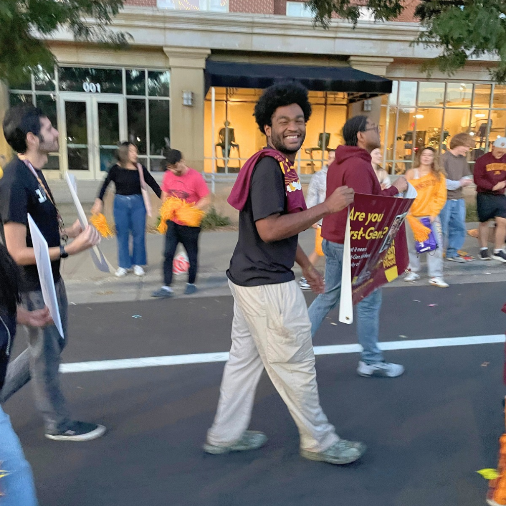 Students walk in the 2025 Homecoming Parade in Dinkytown.