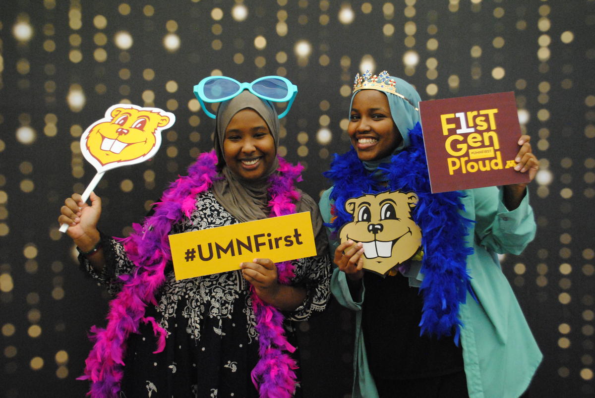 students with props and #UMNFirst signs