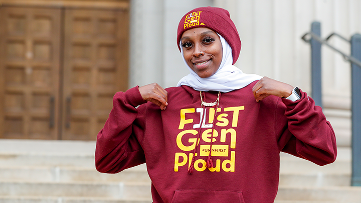 Portrait of student wearing First Gen Proud hoodie